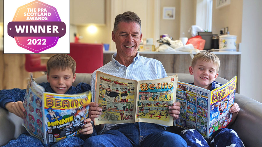 A family reading Beano comics.